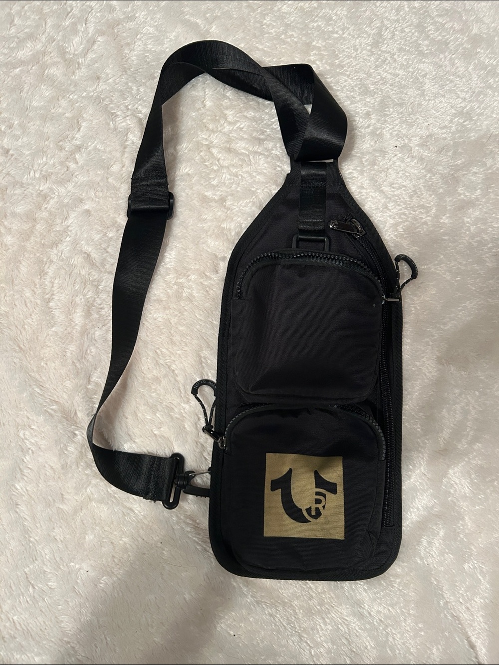 True Religion Black Sling Bag with Gold Logo Patch